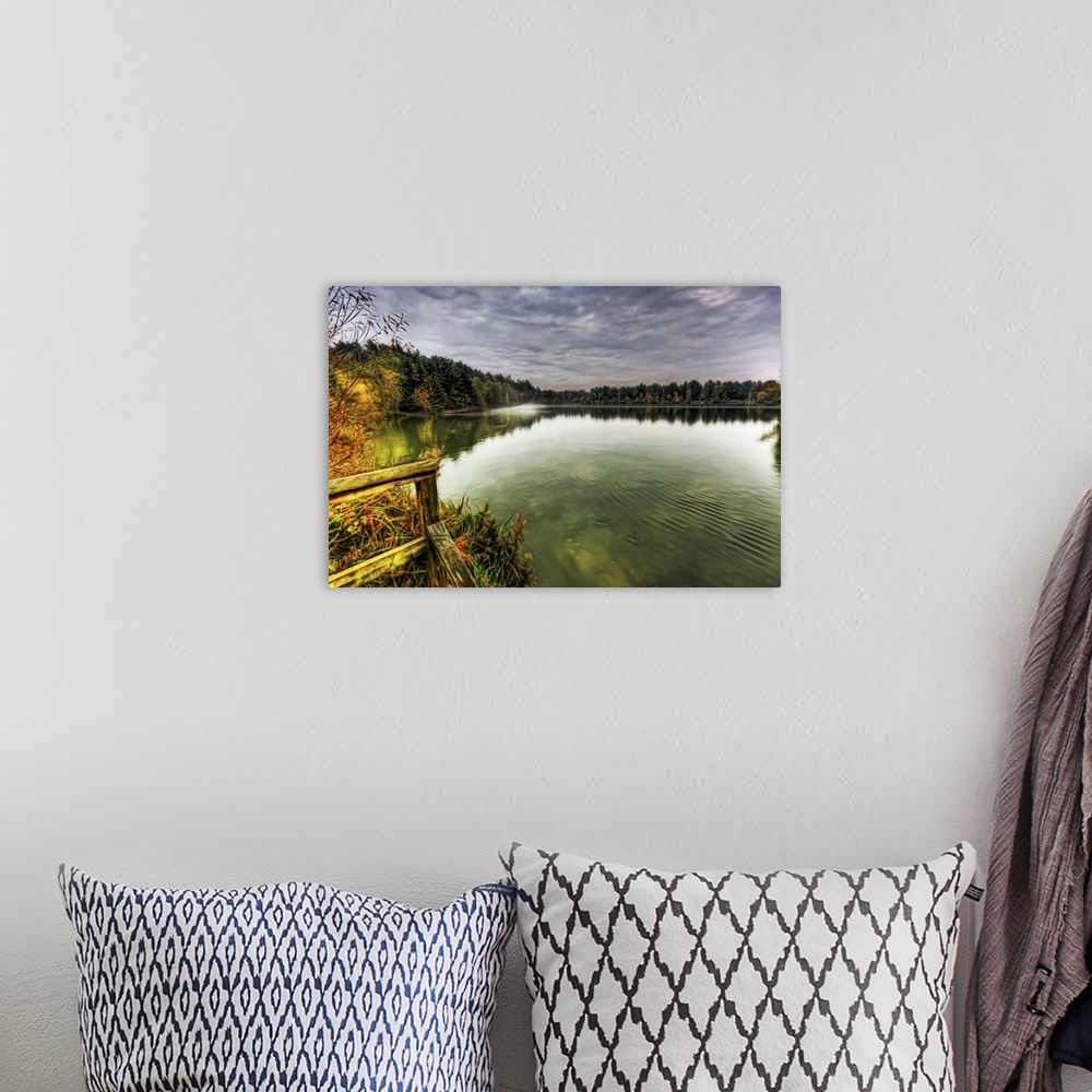 A bohemian room featuring View from a jetty across a misty foggy smooth boating lake with stormy dramatic skies and surroou...