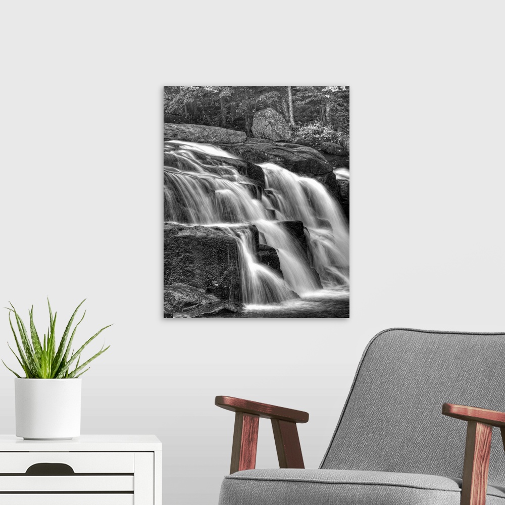 A modern room featuring Water flowing over rocks on a waterfall