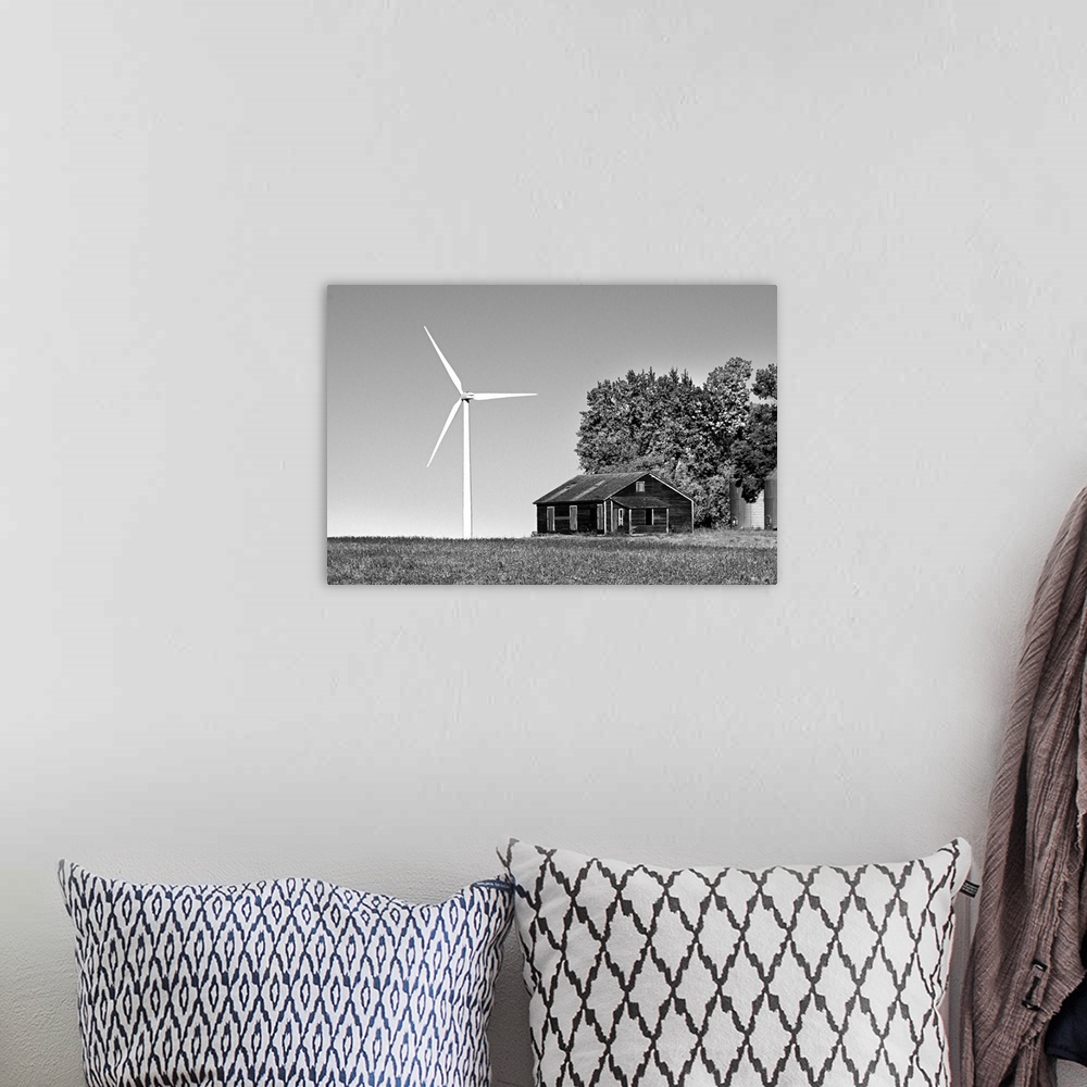 A bohemian room featuring Wind turbine in rural location with old barn in Cavalier County USA
