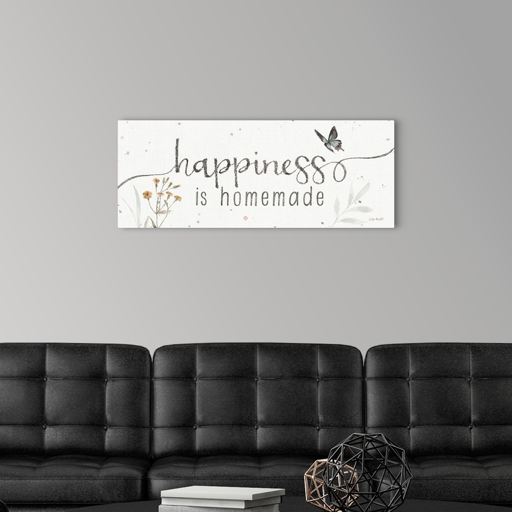 A modern room featuring Decorative artwork featuring the words, 'happiness is homemade'.