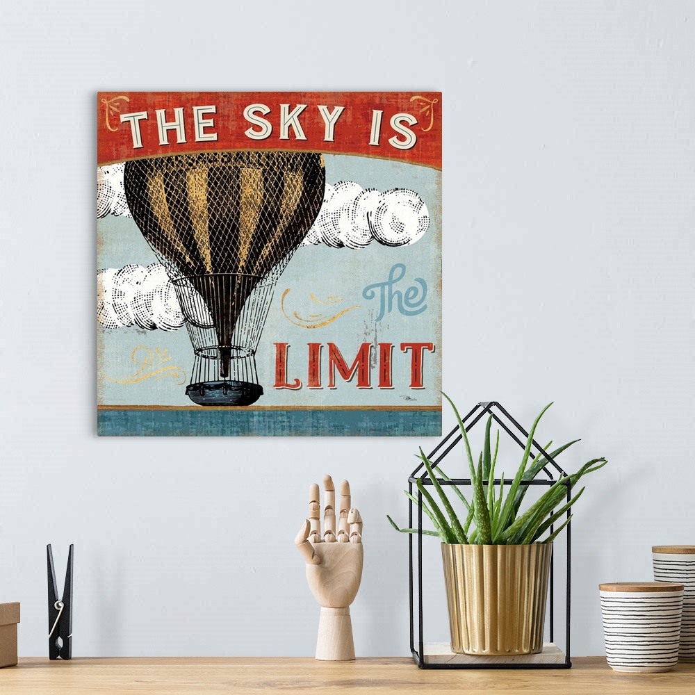 A bohemian room featuring Vintage style poster of a hot air balloon with an inspirational saying.