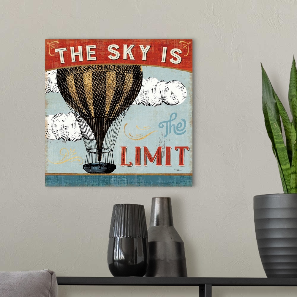 A modern room featuring Vintage style poster of a hot air balloon with an inspirational saying.