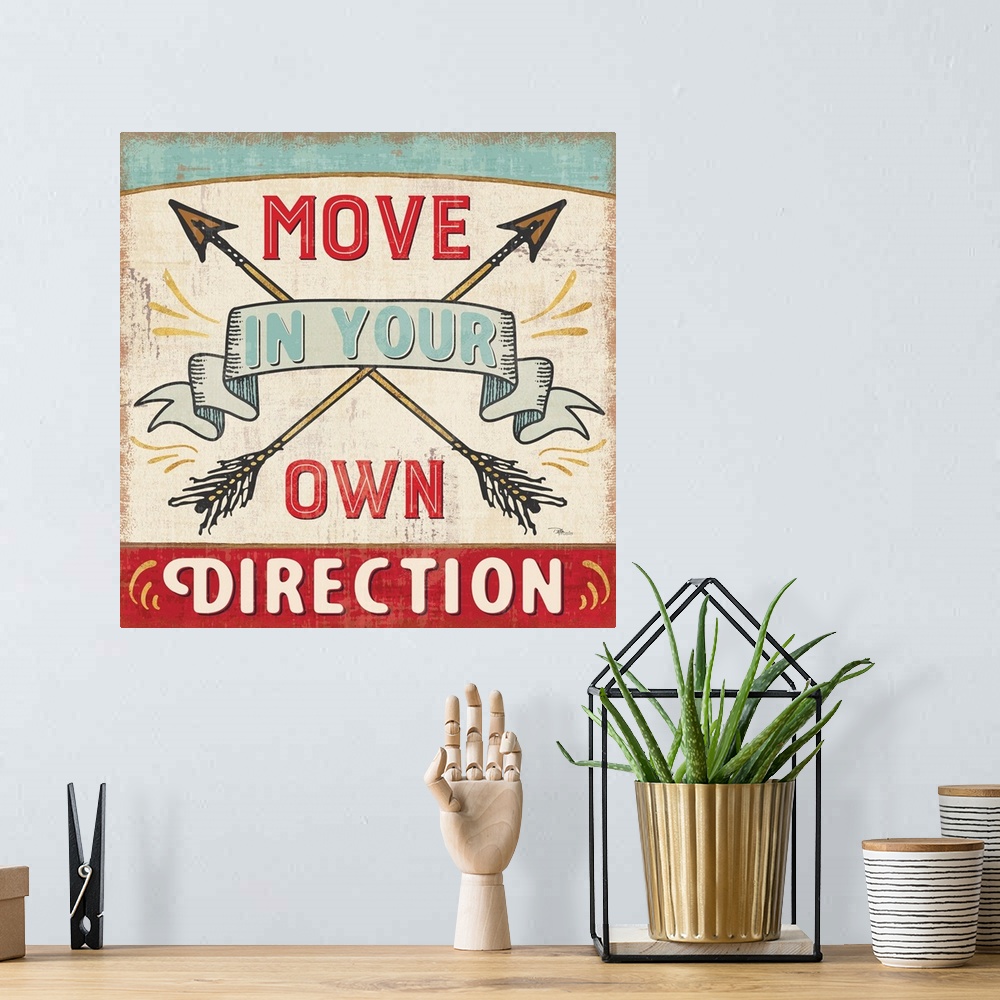 A bohemian room featuring Vintage style sign with crossed arrows reading "Move in your own direction."