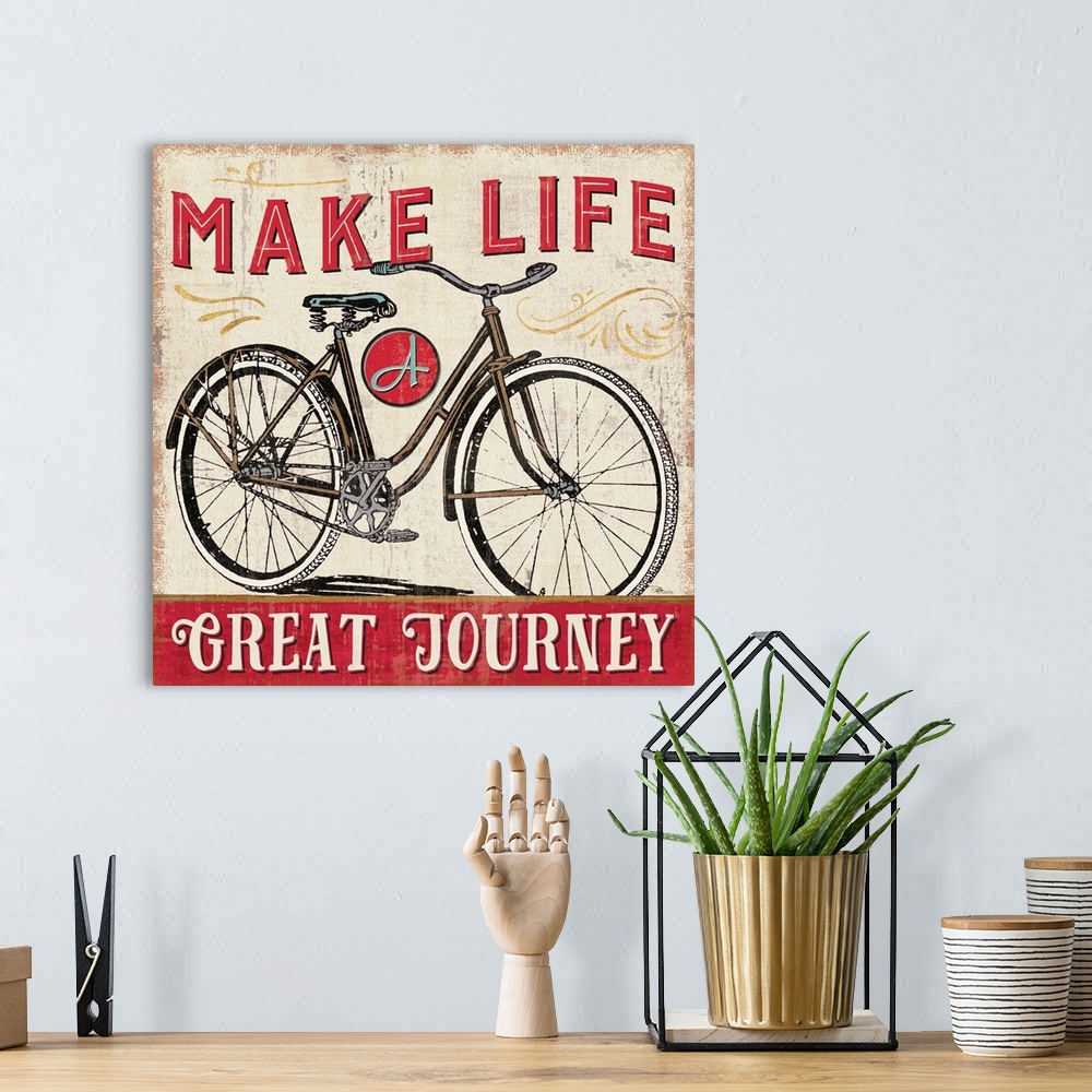 A bohemian room featuring Vintage style poster of a bicycle with an inspirational saying.