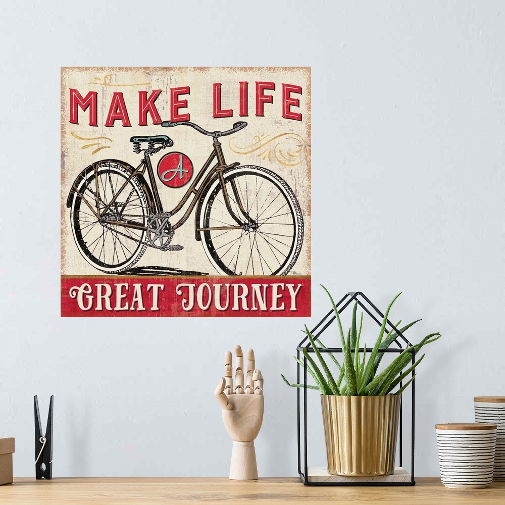 A bohemian room featuring Vintage style poster of a bicycle with an inspirational saying.