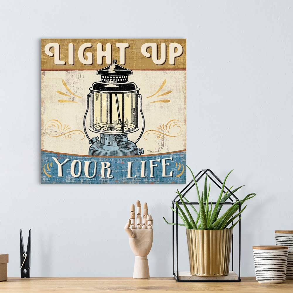 A bohemian room featuring Vintage style poster of a lantern with an inspirational saying.