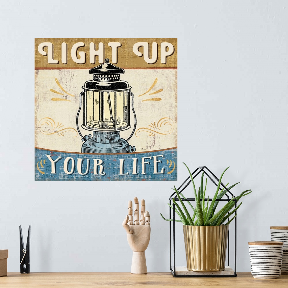 A bohemian room featuring Vintage style poster of a lantern with an inspirational saying.