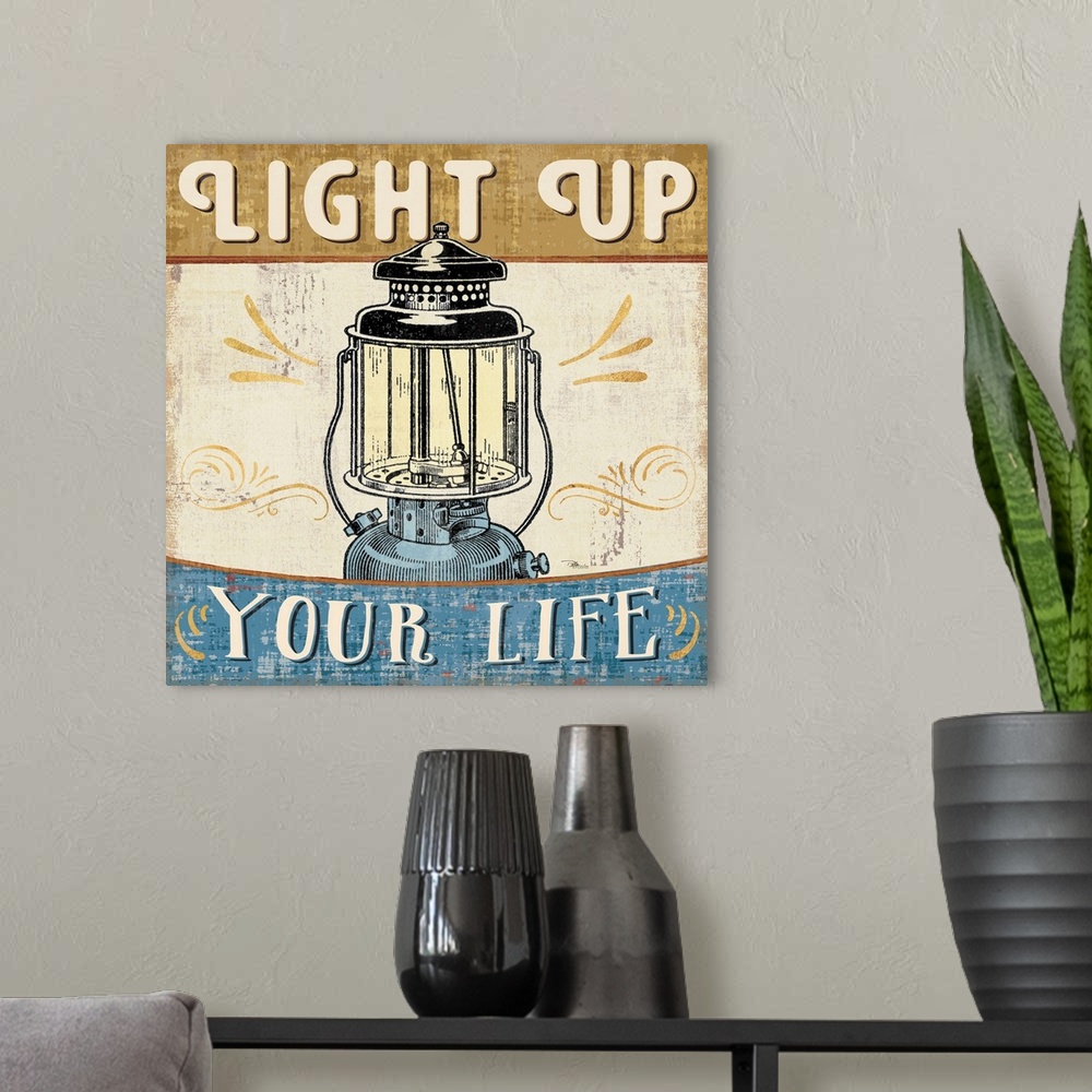 A modern room featuring Vintage style poster of a lantern with an inspirational saying.