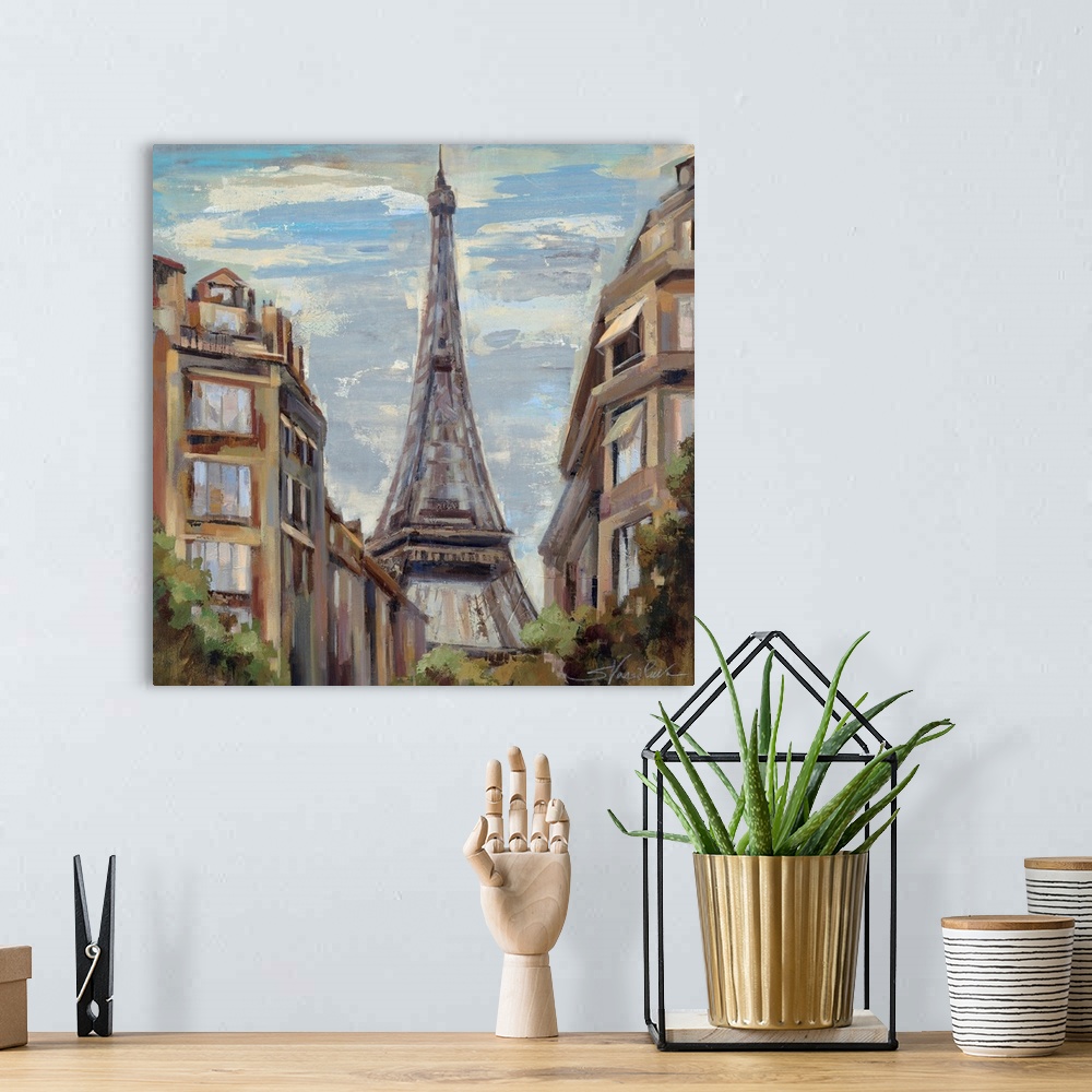 A bohemian room featuring Big, square, scenic painting of tall buildings in Paris, leading to the Eiffel Tower in the center.