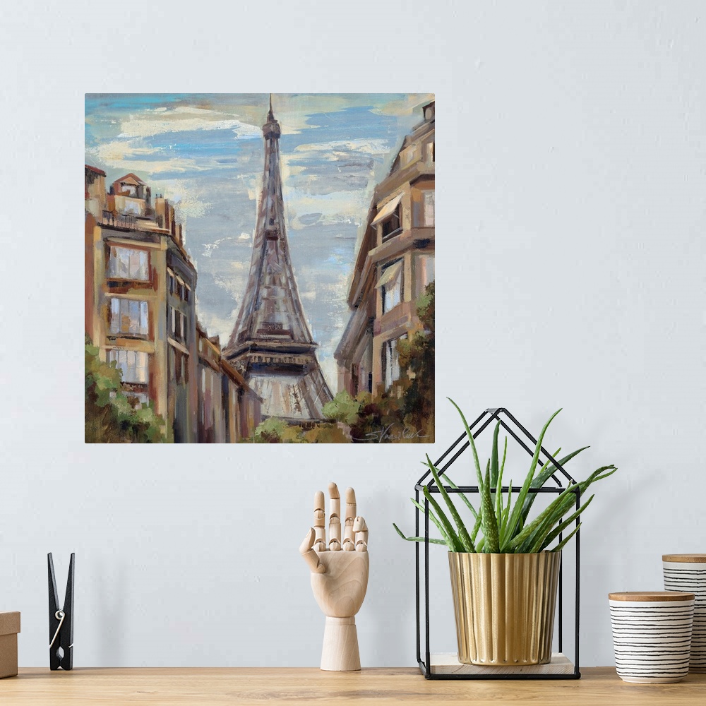 A bohemian room featuring Big, square, scenic painting of tall buildings in Paris, leading to the Eiffel Tower in the center.