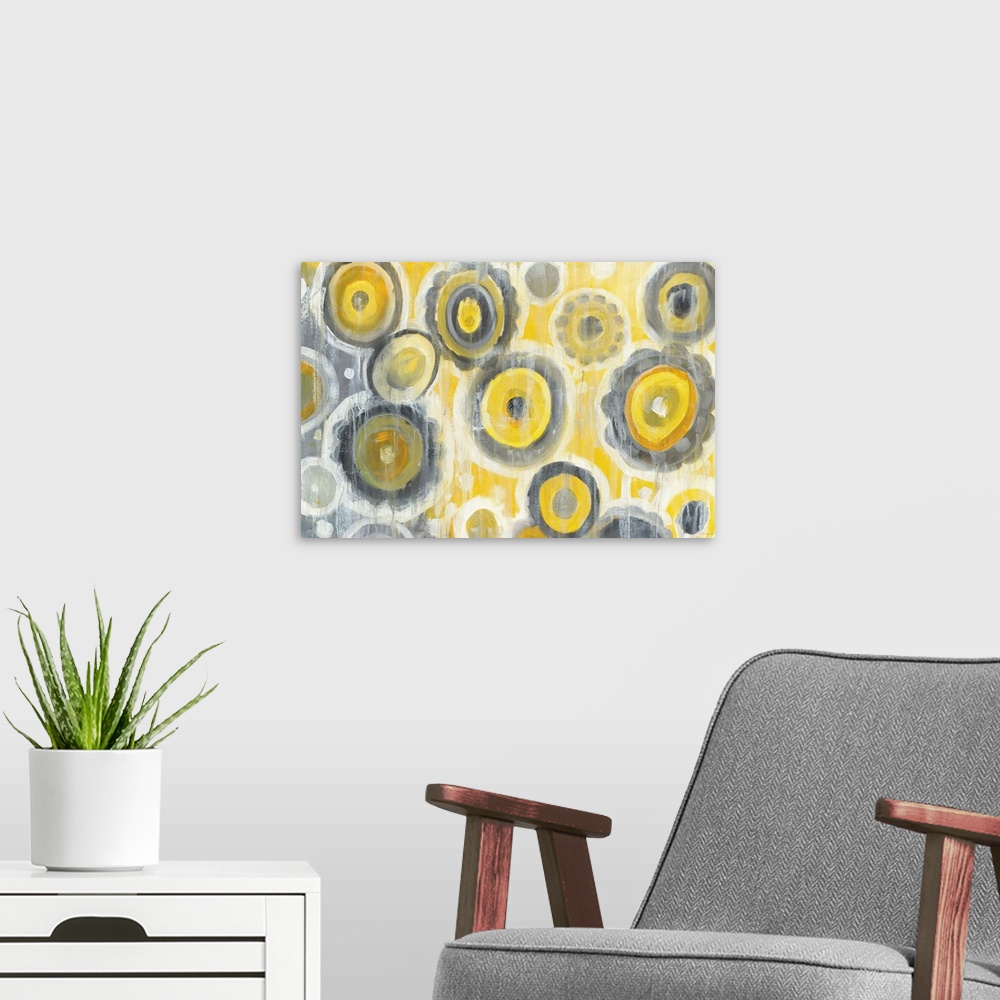A modern room featuring Geometric abstract painting with yellow, gray, and white circles and white paint drips falling fr...