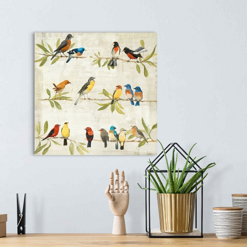 A bohemian room featuring Painting of three rows of branches filled with leaves and birds of different sizes and colors.