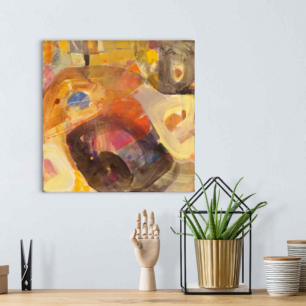 A bohemian room featuring Abstract painting in brown and yellow.