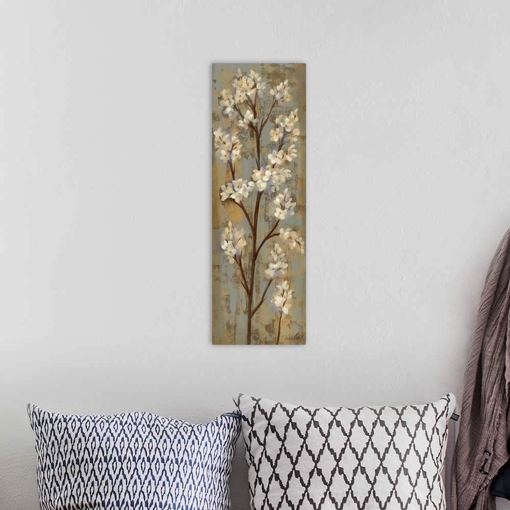A bohemian room featuring This tall vertical piece consists of a painting of a tall branch with white flower petals.
