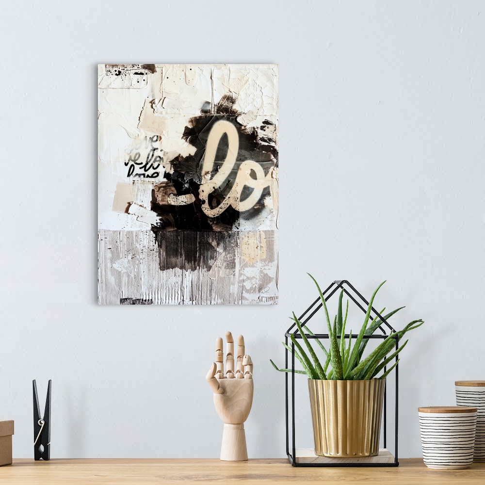 A bohemian room featuring A contemporary mixed media painting featuring layers of paint and paper in neutral shades with sp...