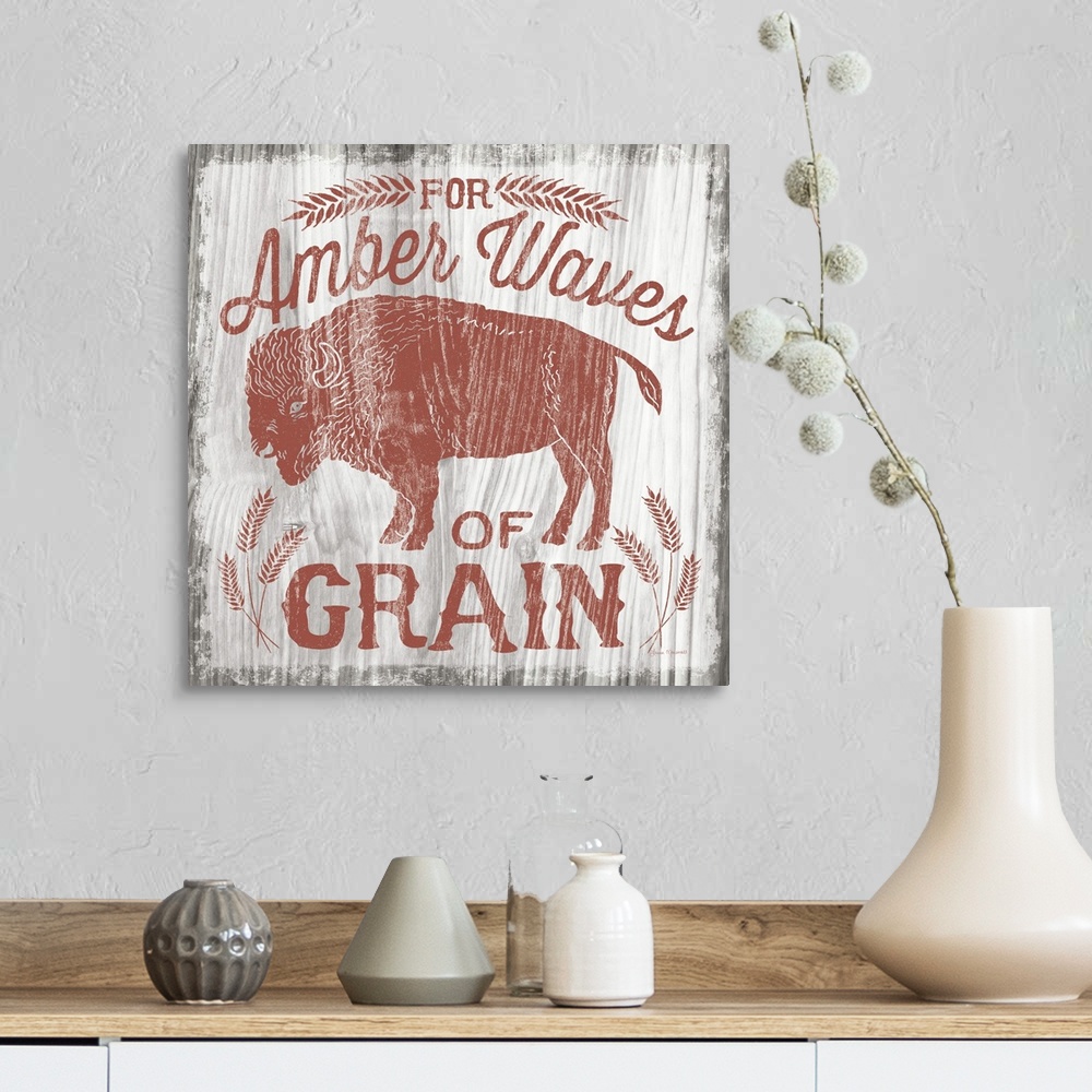 A farmhouse room featuring Contemporary cabin themed artwork of a distressed sign.