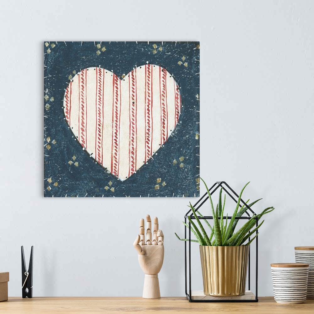 A bohemian room featuring Red, White, and Blue painting of a heart.