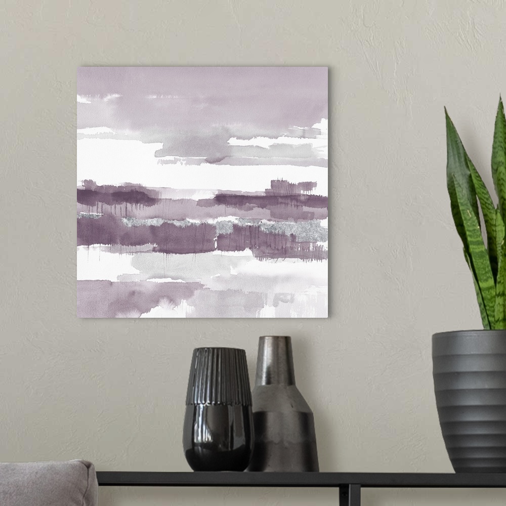A modern room featuring A square watercolor painting of horizontal brush strokes in shades of light purple and grey.