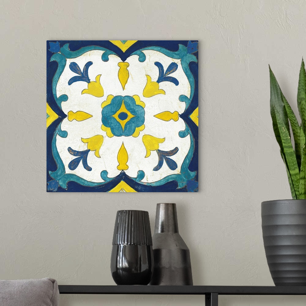 A modern room featuring Decorative square painting of a floral tile design in colors of blue, yellow and white.