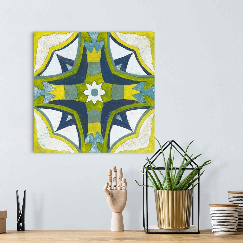 A bohemian room featuring Decorative square painting of a floral tile design in colors of blue, green, yellow and white.