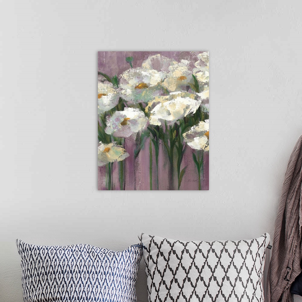 A bohemian room featuring Contemporary artwork of white flowers close-up in the frame of the image. Against a dark purple b...