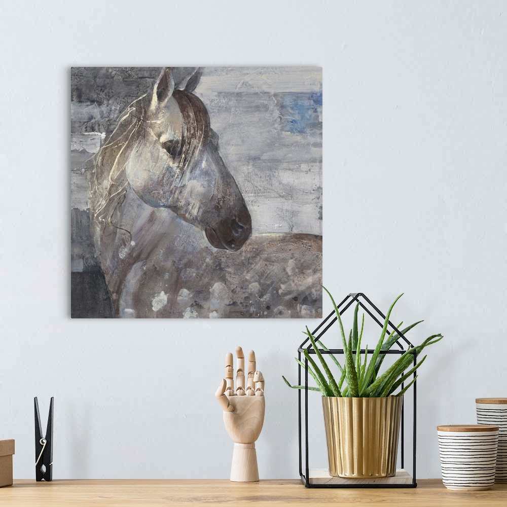 A bohemian room featuring Painting of a spotted appaloosa horse with its head turned around.