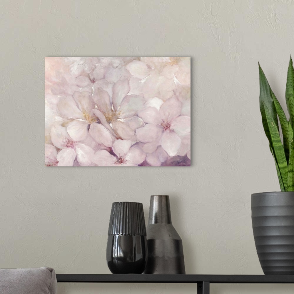 A modern room featuring Abstract painting of apple blossom flowers with warm pink and purple tones.