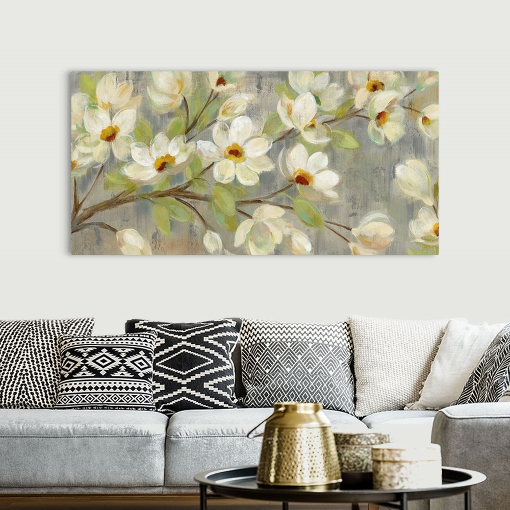 A bohemian room featuring Contemporary painting of magnolia flowers against a pale green background.