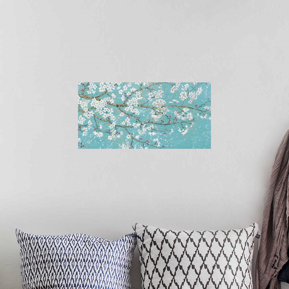 A bohemian room featuring Contemporary painting of branches with white flower blossoms.