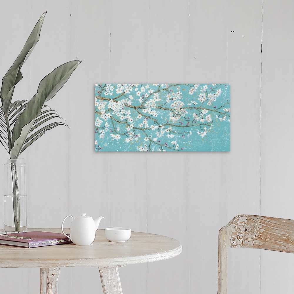 A farmhouse room featuring Contemporary painting of branches with white flower blossoms.
