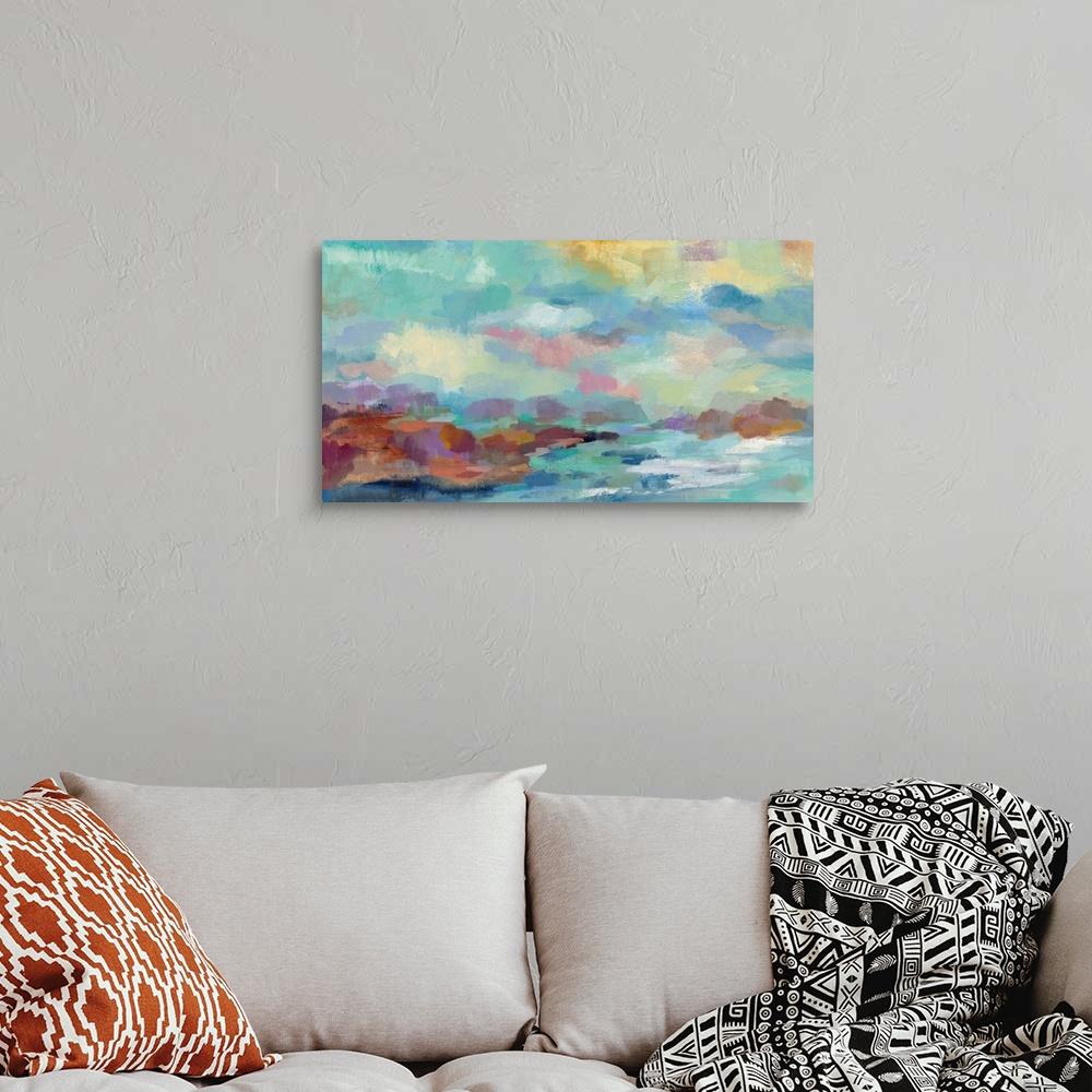 A bohemian room featuring Semi-abstract contemporary painting of a seascape with a rocky coast.