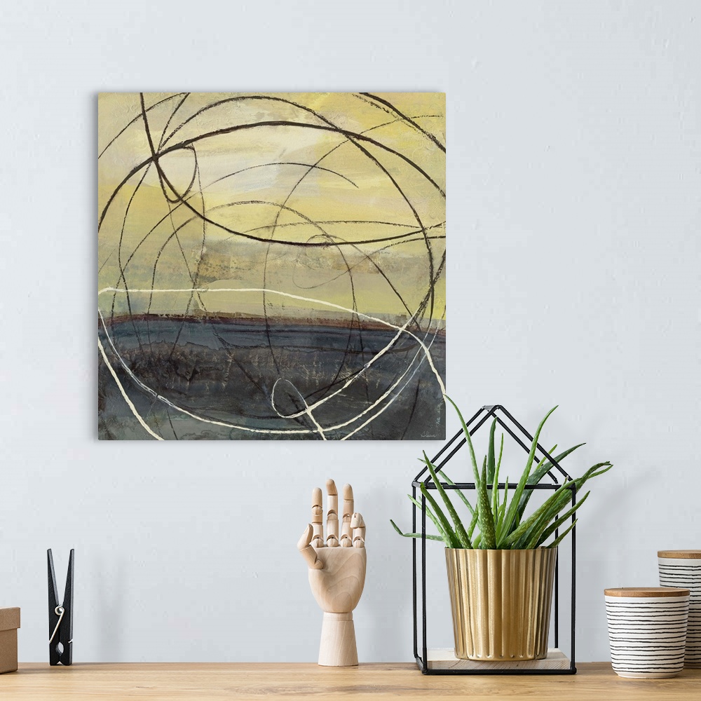 A bohemian room featuring Abstract artwork in black and yellow with circular lines.