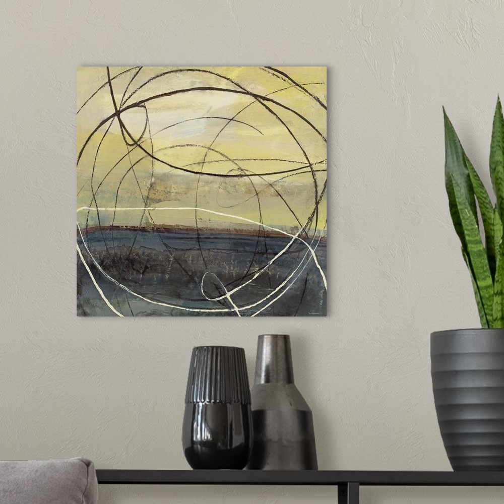 A modern room featuring Abstract artwork in black and yellow with circular lines.