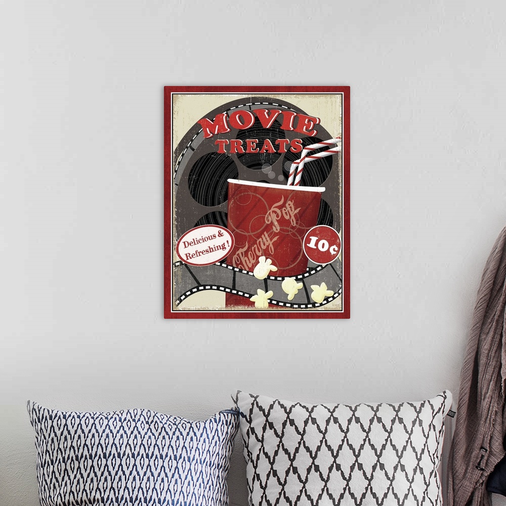 A bohemian room featuring A vintage poster of a movie reel with a cup of soda drawn in front of it and some kernels of popc...