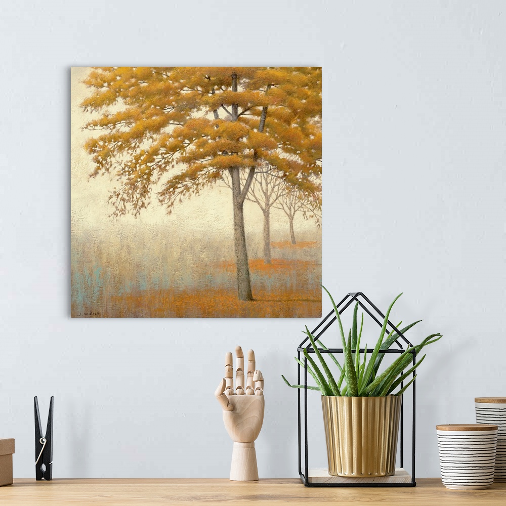 A bohemian room featuring Painting on canvas of a line of trees in a foggy landscape.