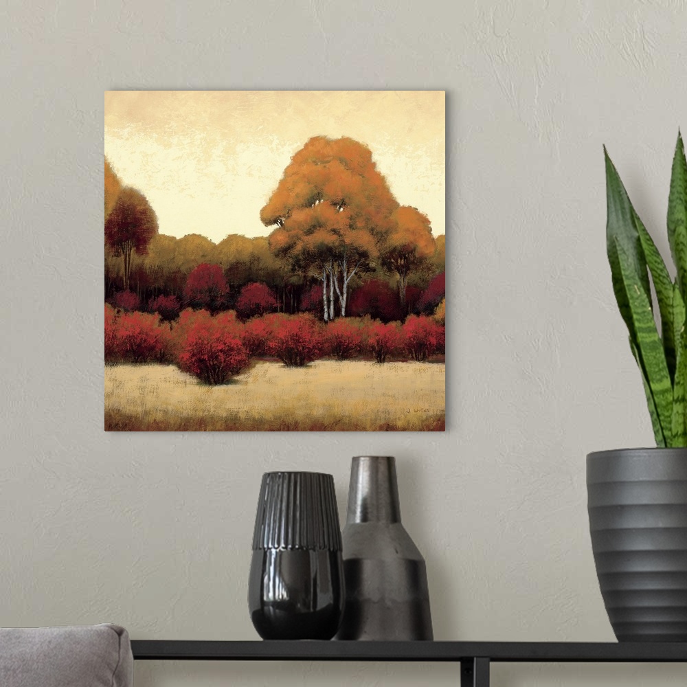 A modern room featuring Square home art docor on a large canvas of a warm landscape of trees and bushes on a golden backg...