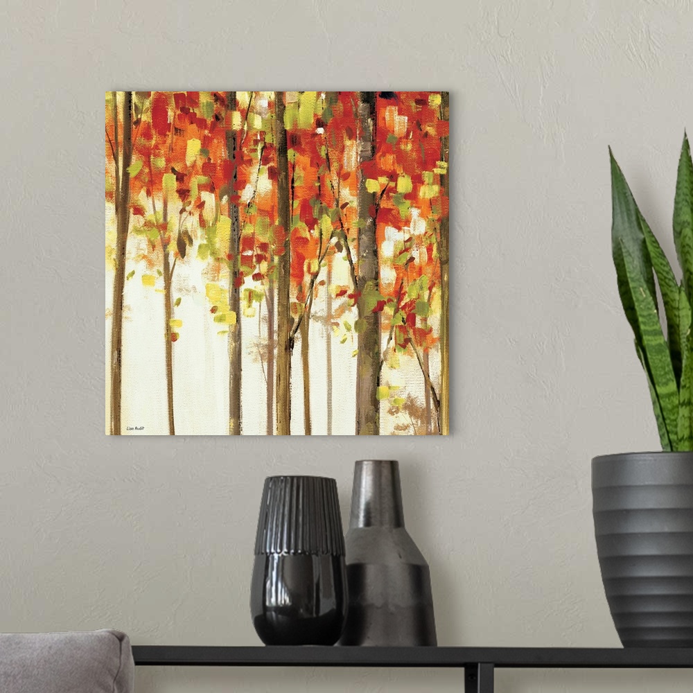A modern room featuring Contemporary painting of tree tops covered in fall colored foliage.