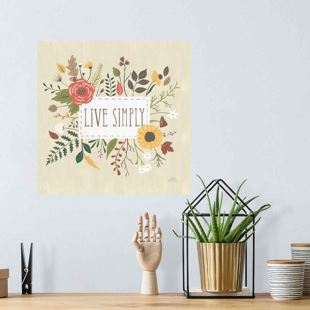 A bohemian room featuring "Live Simply" written in a white rectangle on a light tan background, surrounded by Autumn flowers.
