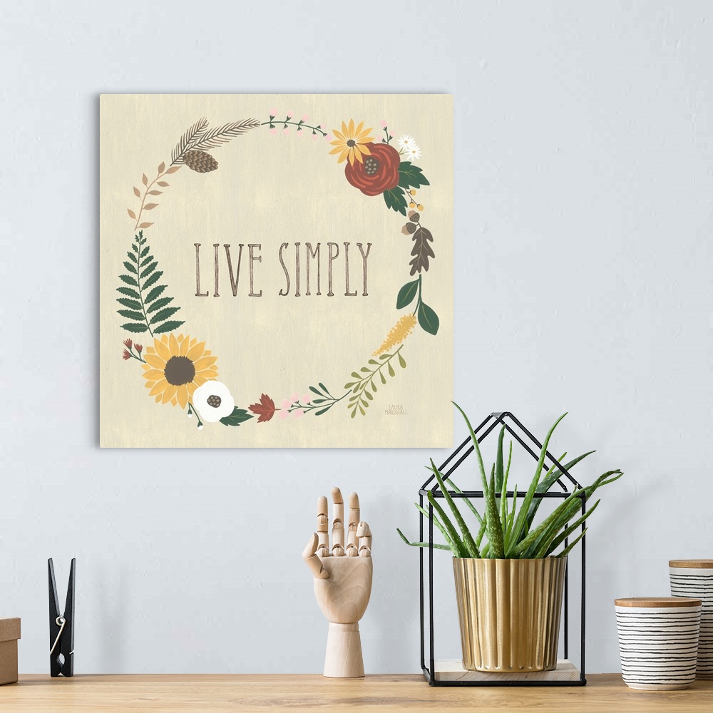 A bohemian room featuring "Live Simply" in the center of a wreath of autumn flowers on a beige background.