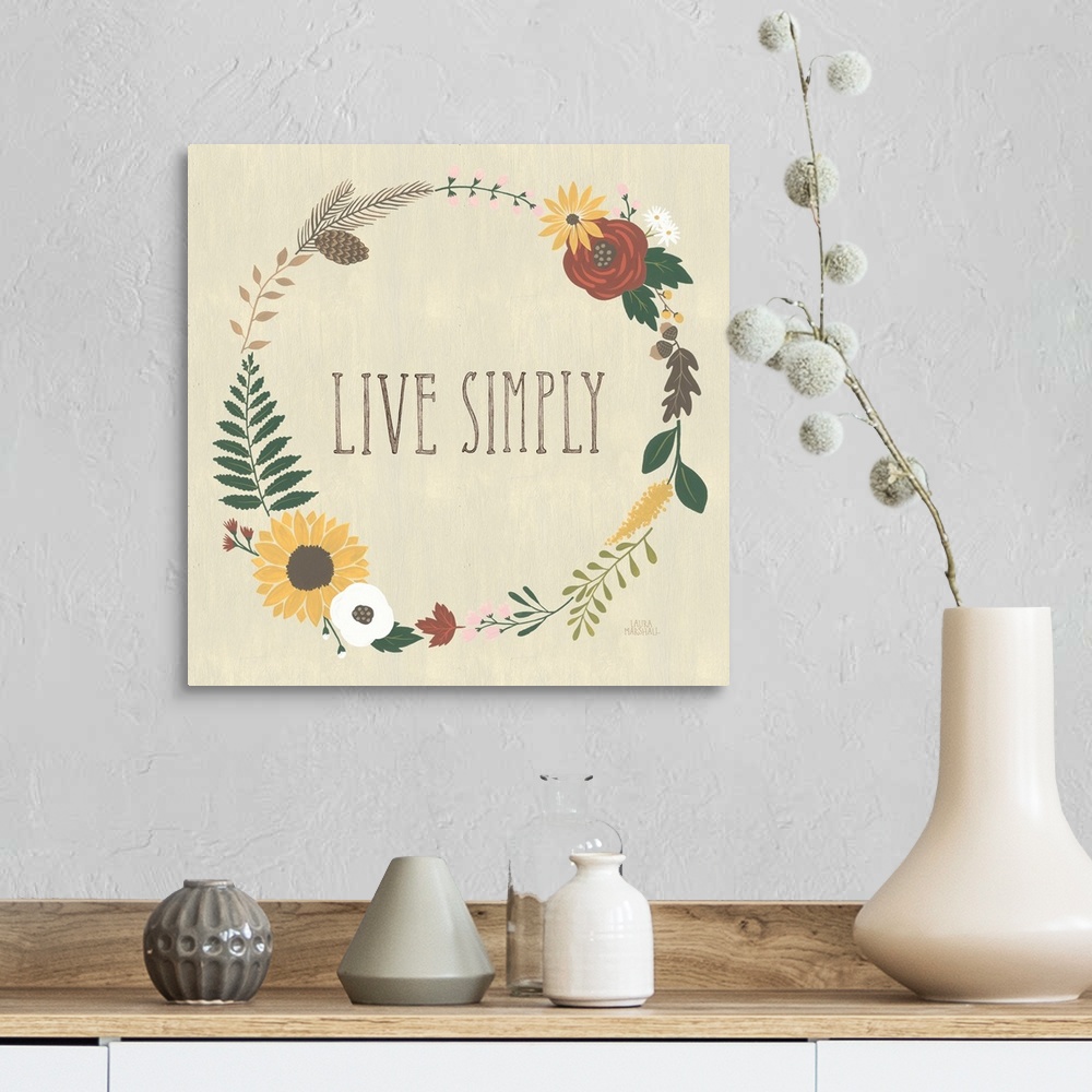 A farmhouse room featuring "Live Simply" in the center of a wreath of autumn flowers on a beige background.