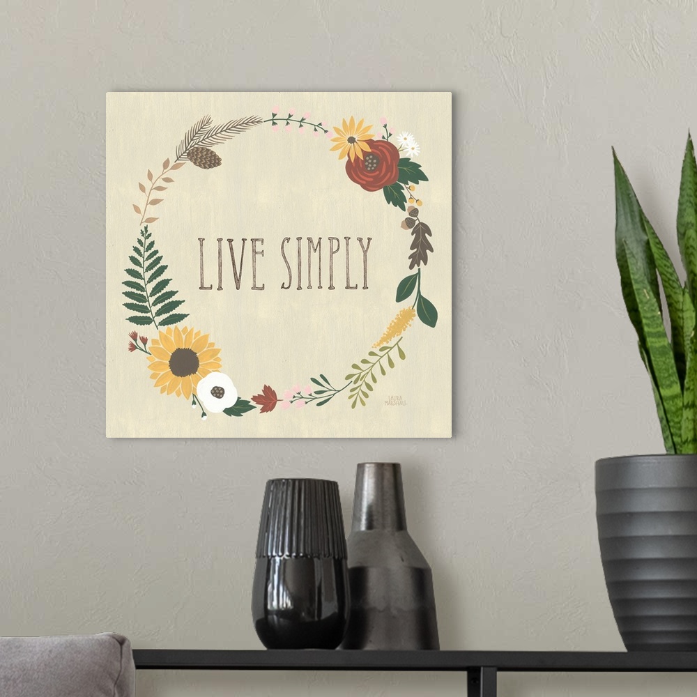 A modern room featuring "Live Simply" in the center of a wreath of autumn flowers on a beige background.