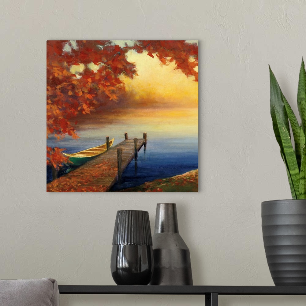 A modern room featuring Contemporary artwork of a small pier with a boat in a lake with fall leaves.