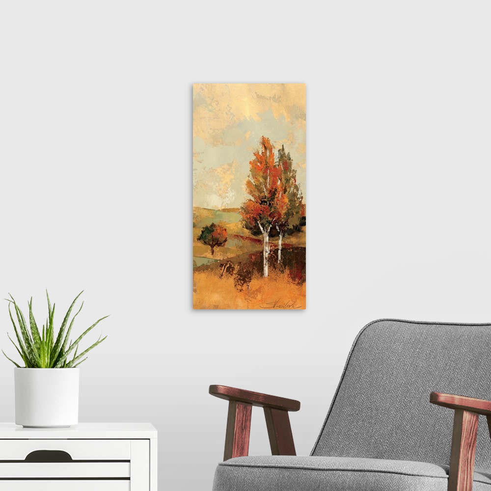 A modern room featuring Portrait, large wall painting of a fall scene of rolling hills and several trees with autumn colo...