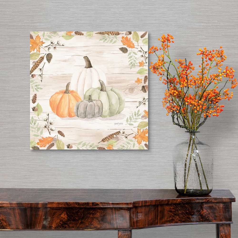 A traditional room featuring Decorative artwork of fall leaves framing a group of pumpkins and a white wood background.