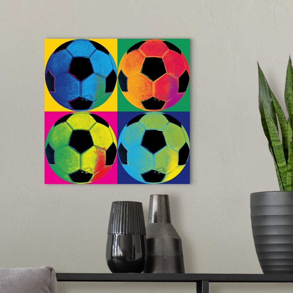 A modern room featuring A square canvas of soccer balls of various neon colors in each of the four quadrants with a diffe...