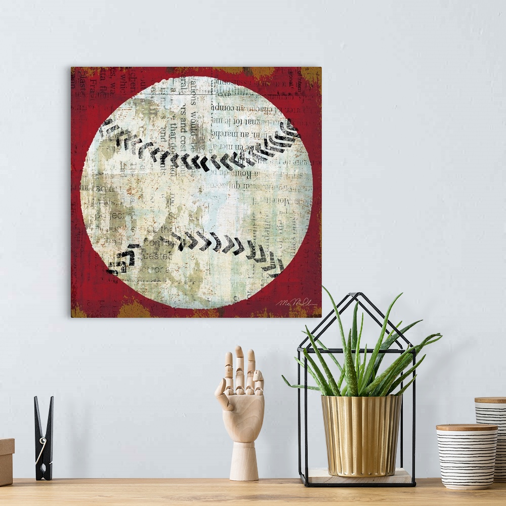 A bohemian room featuring Square shaped and sports themed wall art; a simplified baseball painted on top of a collage of a ...