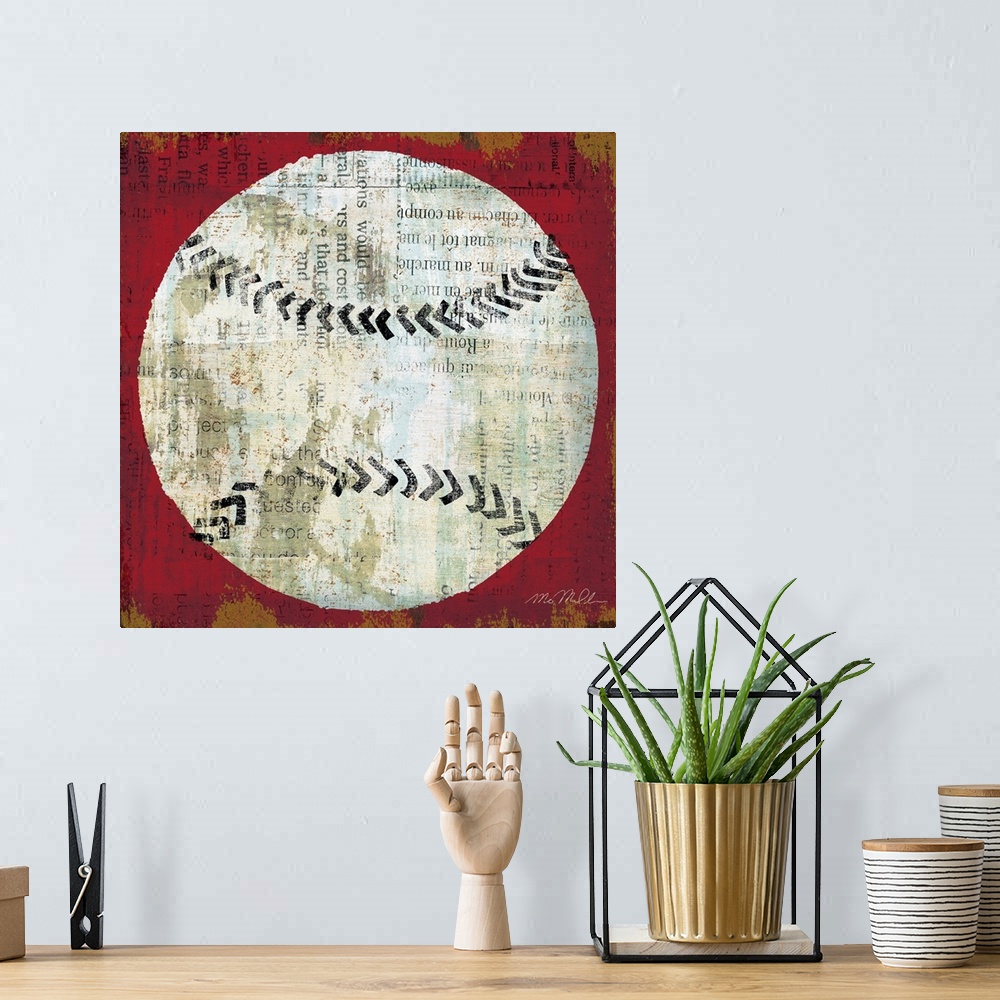 A bohemian room featuring Square shaped and sports themed wall art; a simplified baseball painted on top of a collage of a ...