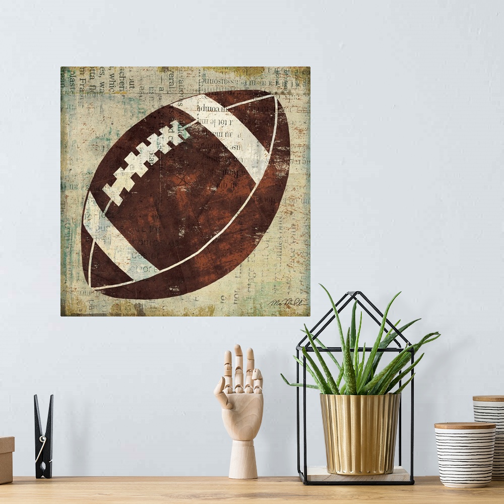 A bohemian room featuring Home decor wall art that is square in shape. This artwork is a simplified American football paint...