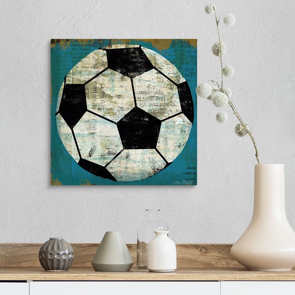 A farmhouse room featuring Large retro art depicts a soccer ball incorporating various lines of text within the blank spaces...