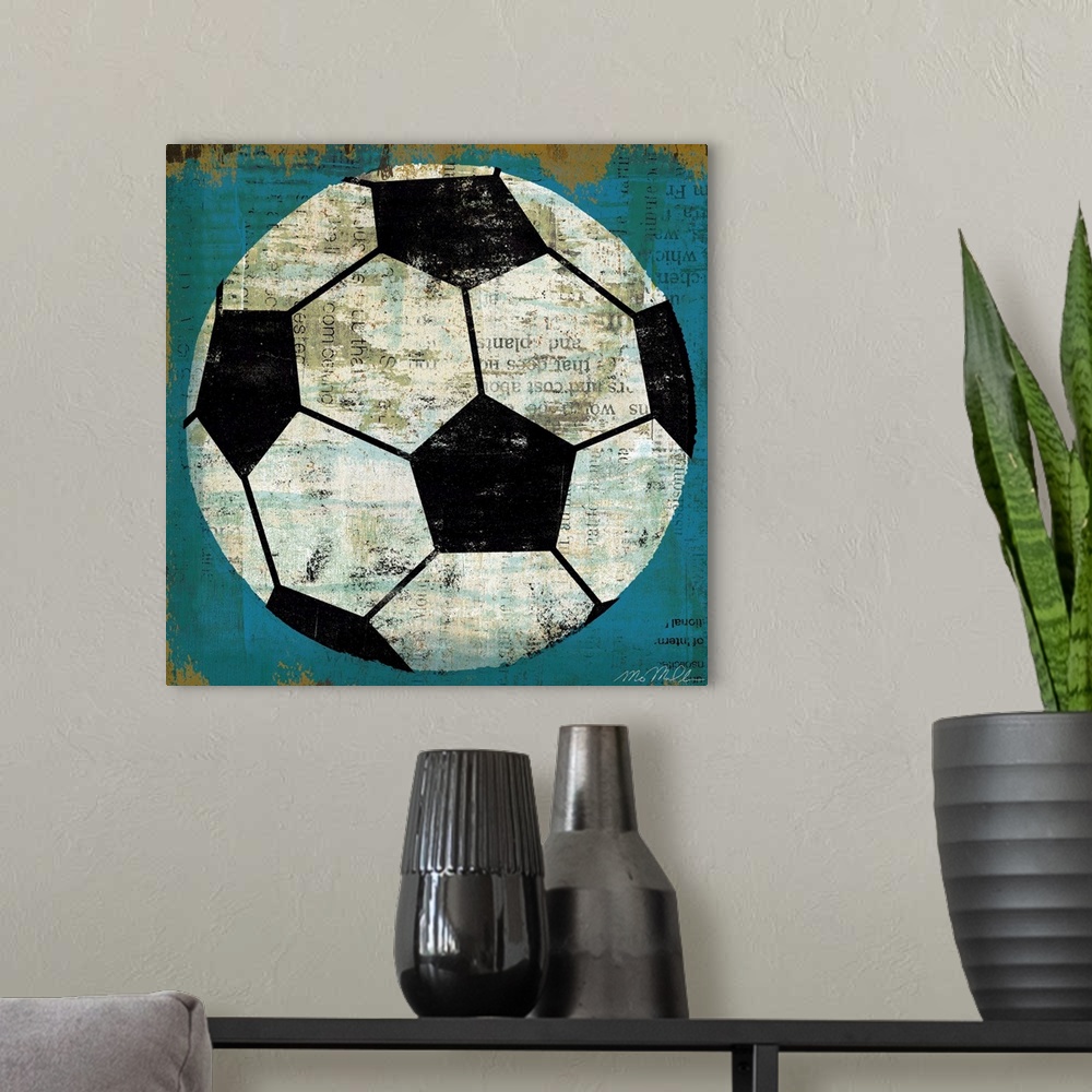 A modern room featuring Large retro art depicts a soccer ball incorporating various lines of text within the blank spaces...